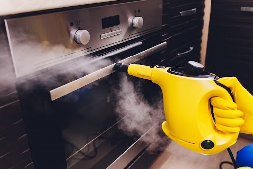 Utilize a steam cleaner to sanitize your cabinets