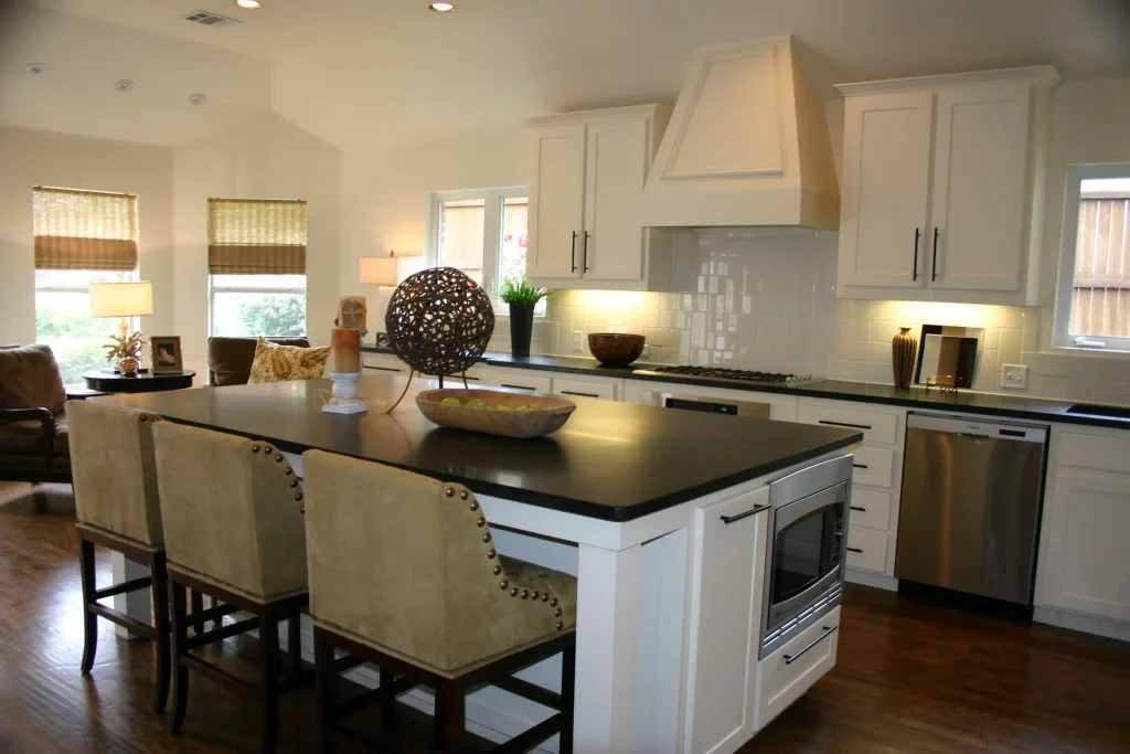 white kitchen cabinets with black countertops