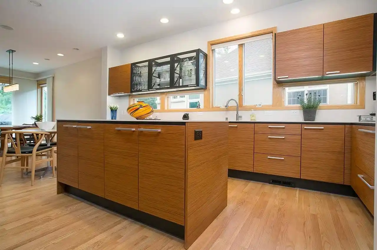 Frameless wood grain kitchen cabinets with full overlay doors and narrow reveals